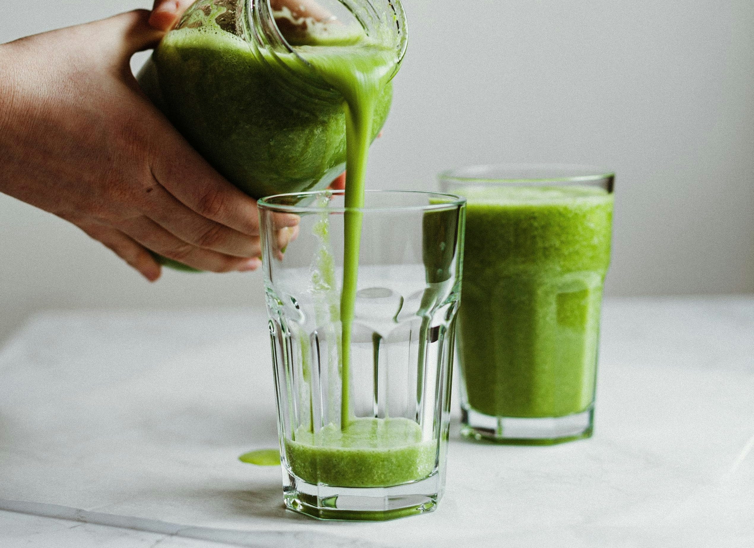 A healthy green smoothie perfect for breast cancer patients to increase their intake of antioxidants, vitamins, and minerals from fruits and vegetables.